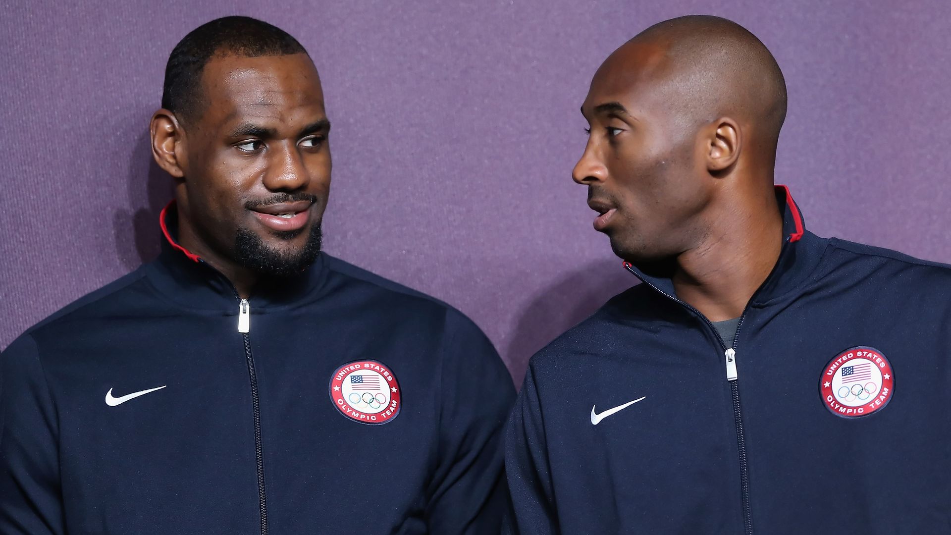 LeBron James (L) and Kobe Bryant (R) look on during a basketball press conference on July 27, 2012, in London, England, ahead of the London 2012 Olympics.  