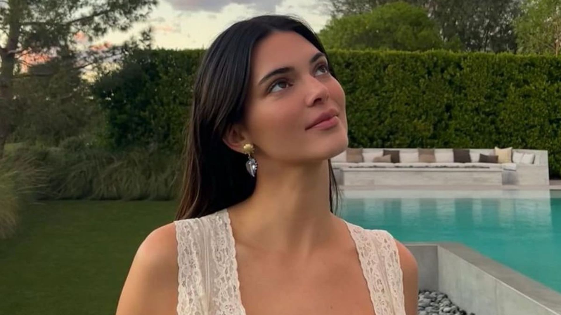 Kendall Jenner poses in nothing but a button-down shirt while relaxing in bed: ‘off-duty attire’