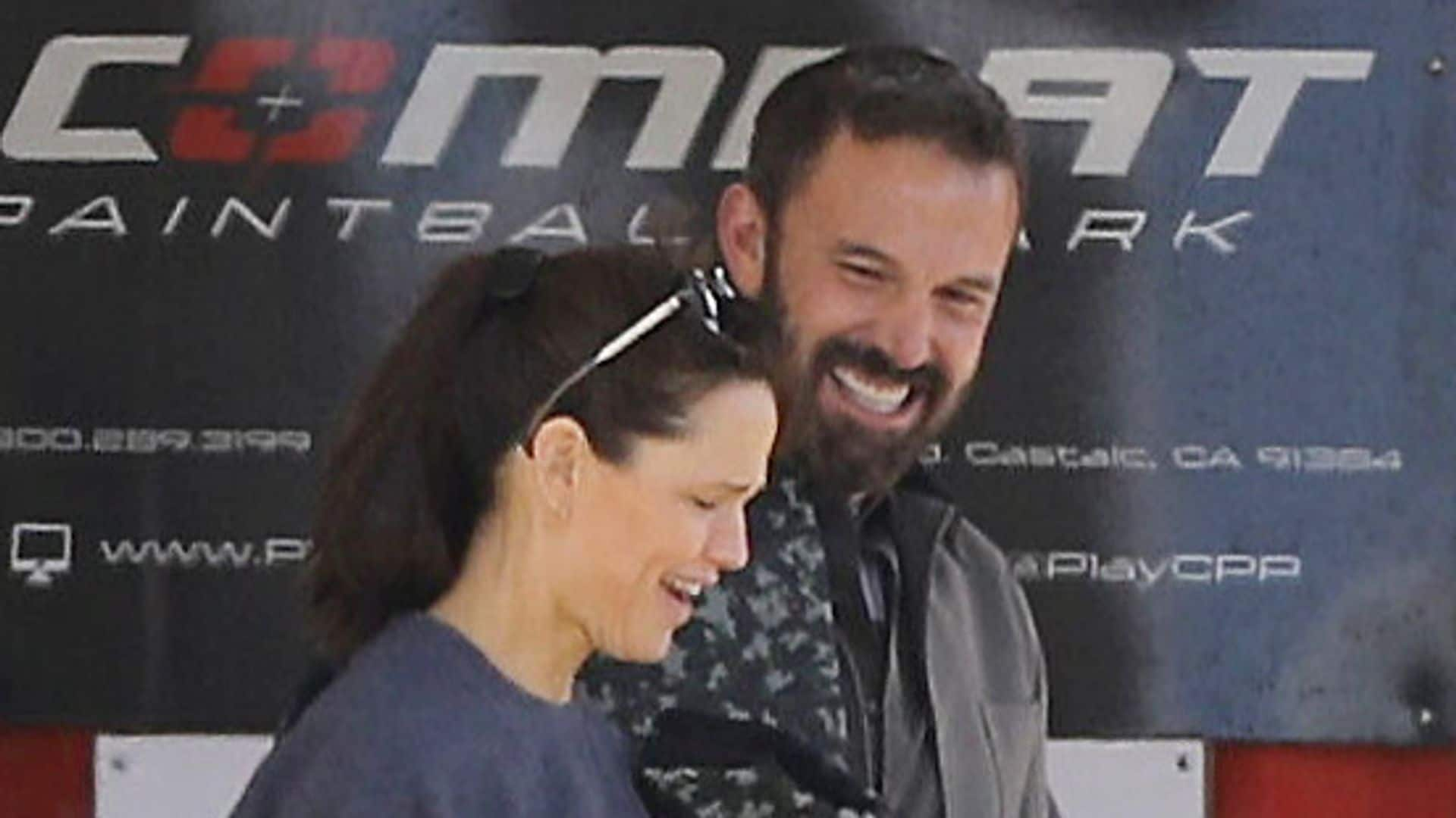 Ben Affleck and Jennifer Garner laugh as they play paintball with their kids