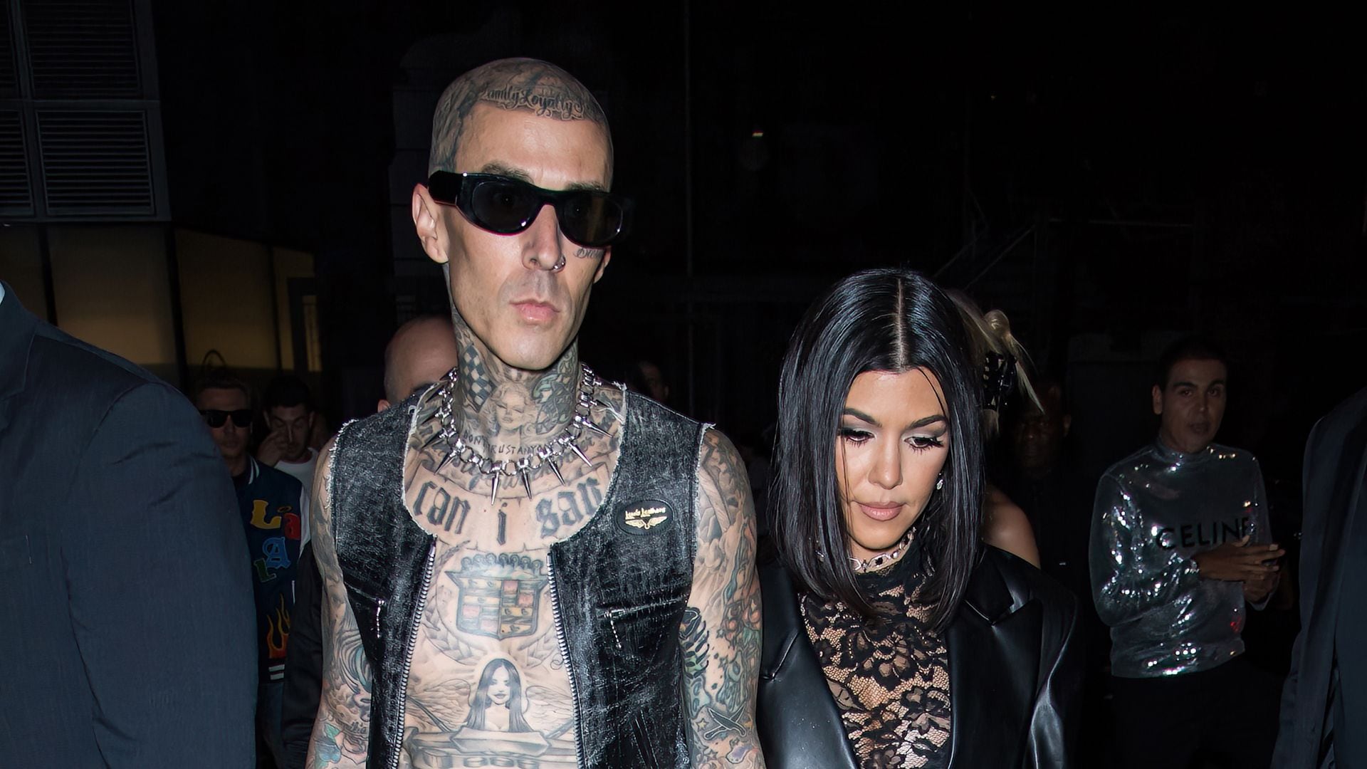 Kourtney Kardashian and Travis Barker celebrate the holidays with family in all-black outfits