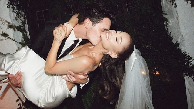 Ariana Grande and Dalton Gomez kiss at their wedding