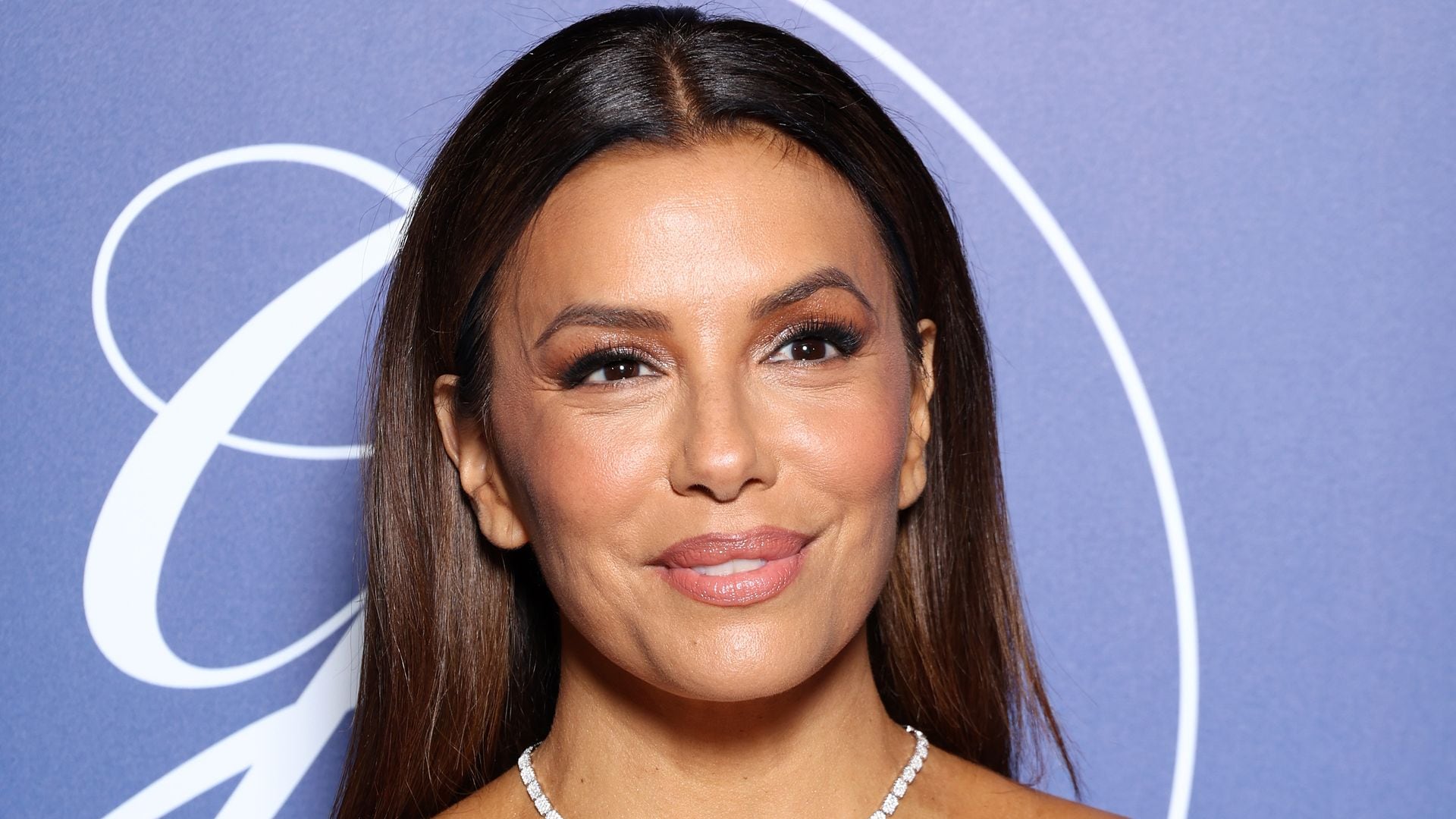 Eva Longoria holds hands with her 6-year-old son Santiago while attending  the Global Gift Gala