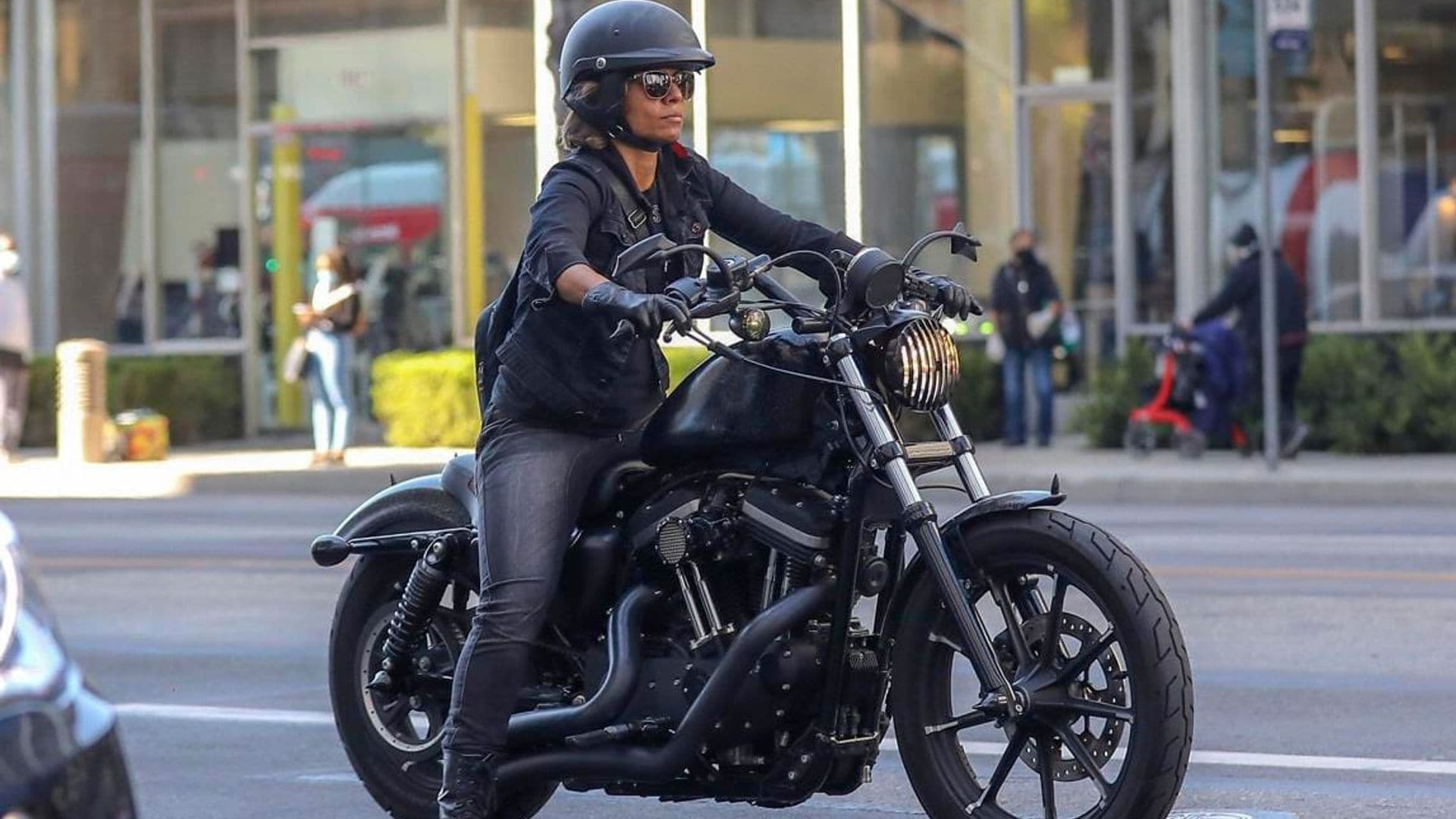 Halle Berry looks biker chic while riding a Harley Davidson motorcycle