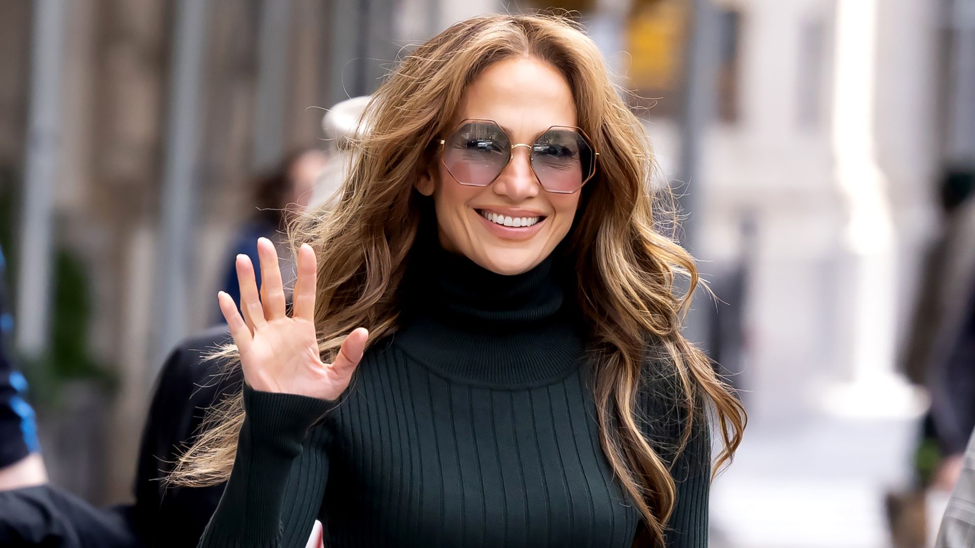 Jennifer Lopez shows off her figure in all-white look including the perfect fall jacket