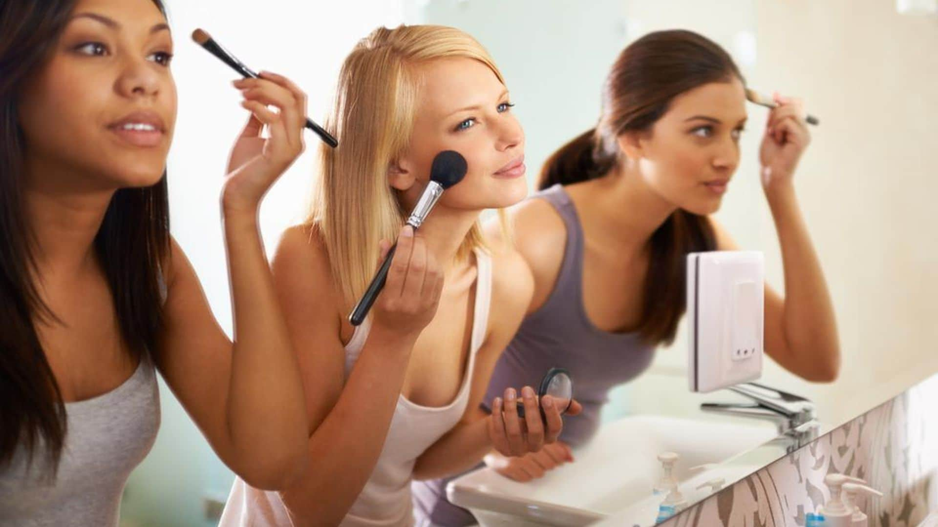 Women putting on makeup