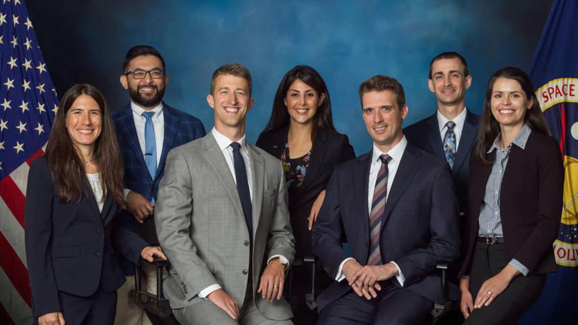 A photo of NASA's 2022 class of flight directors who will oversee operations of the International Space Station, commercial crew, and Artemis missions to the Moon. The inductees from left to right: Heidi Brewer, Ronak Dave, Garrett Hehn, Diana Trujillo, Elias Myrmo, Chris Dobbins, Nicole McElroy.