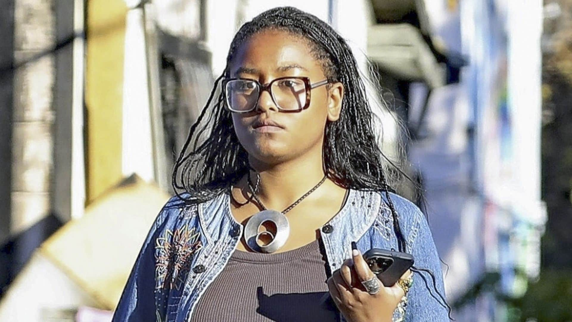 Sasha Obama steps out in Los Angeles wearing brown button-down and jean shorts