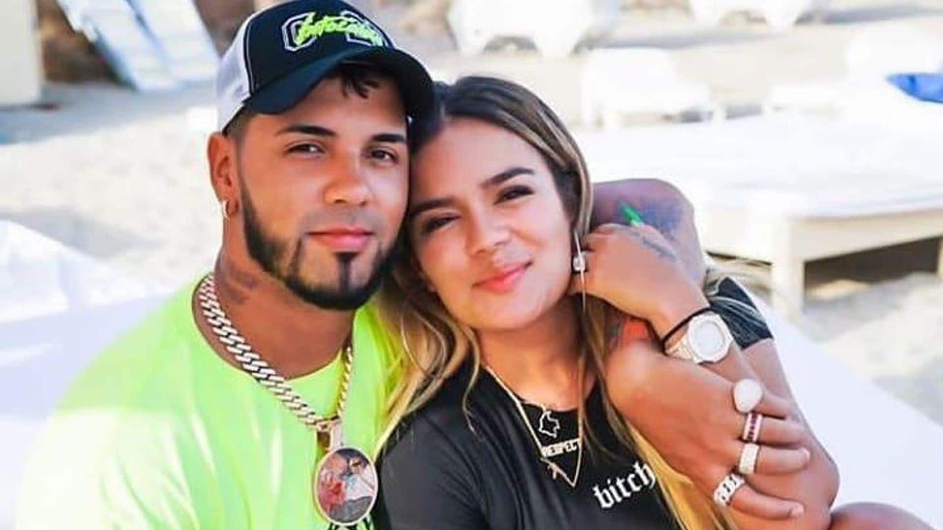 Karol G and Anuel AA posing together