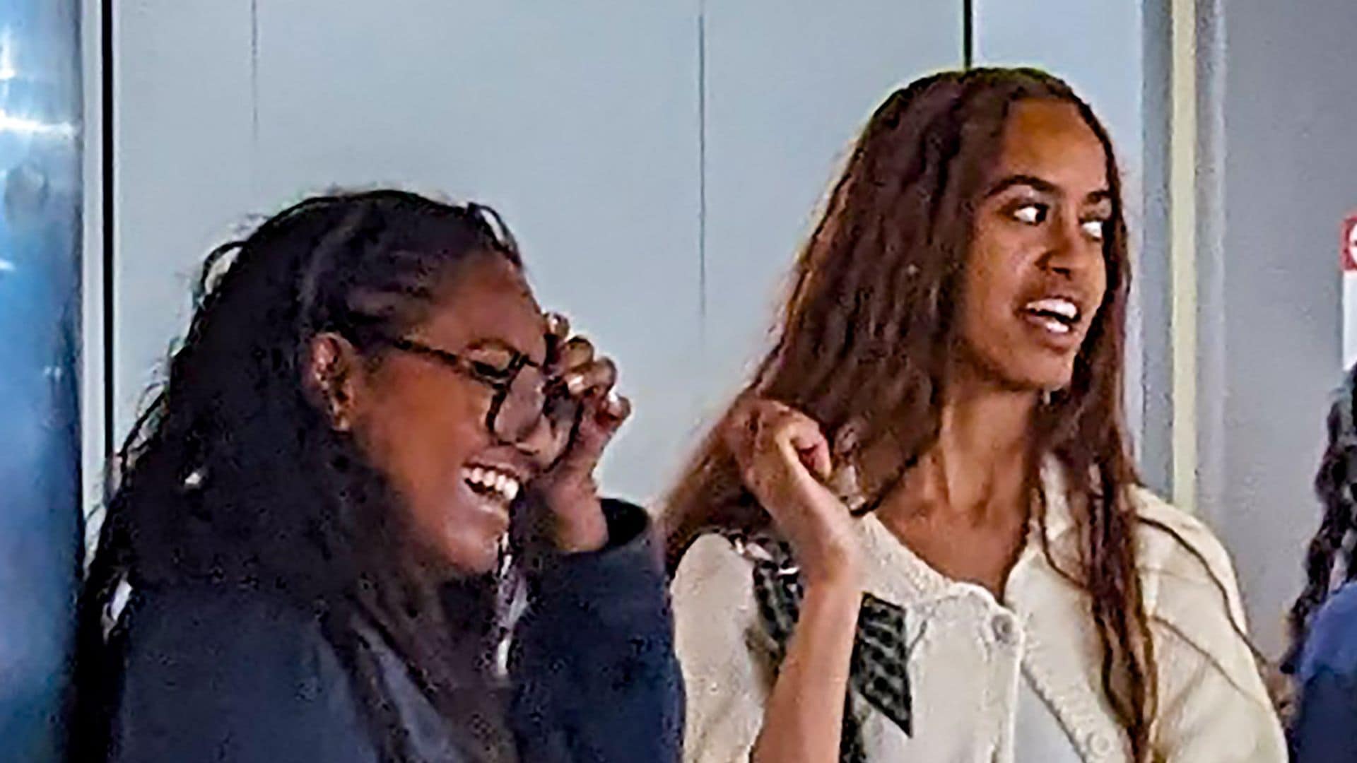 Barack Obama bonds with his daughters Sasha and Malia at dinner in Los Angeles