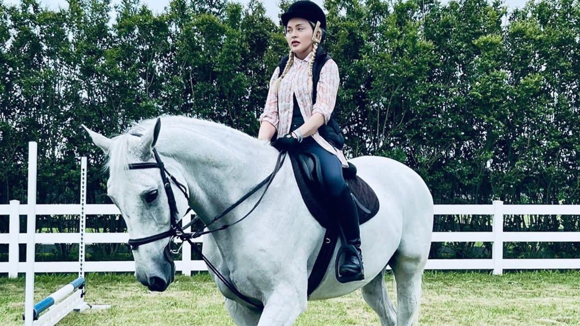 Madonna rides a horse while relaxing on the ranch with her kids