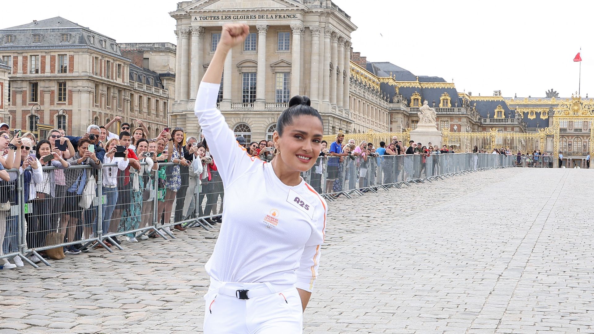 Salma Hayek is the latest celebrity to carry the Olympic torch ahead of Opening Ceremony