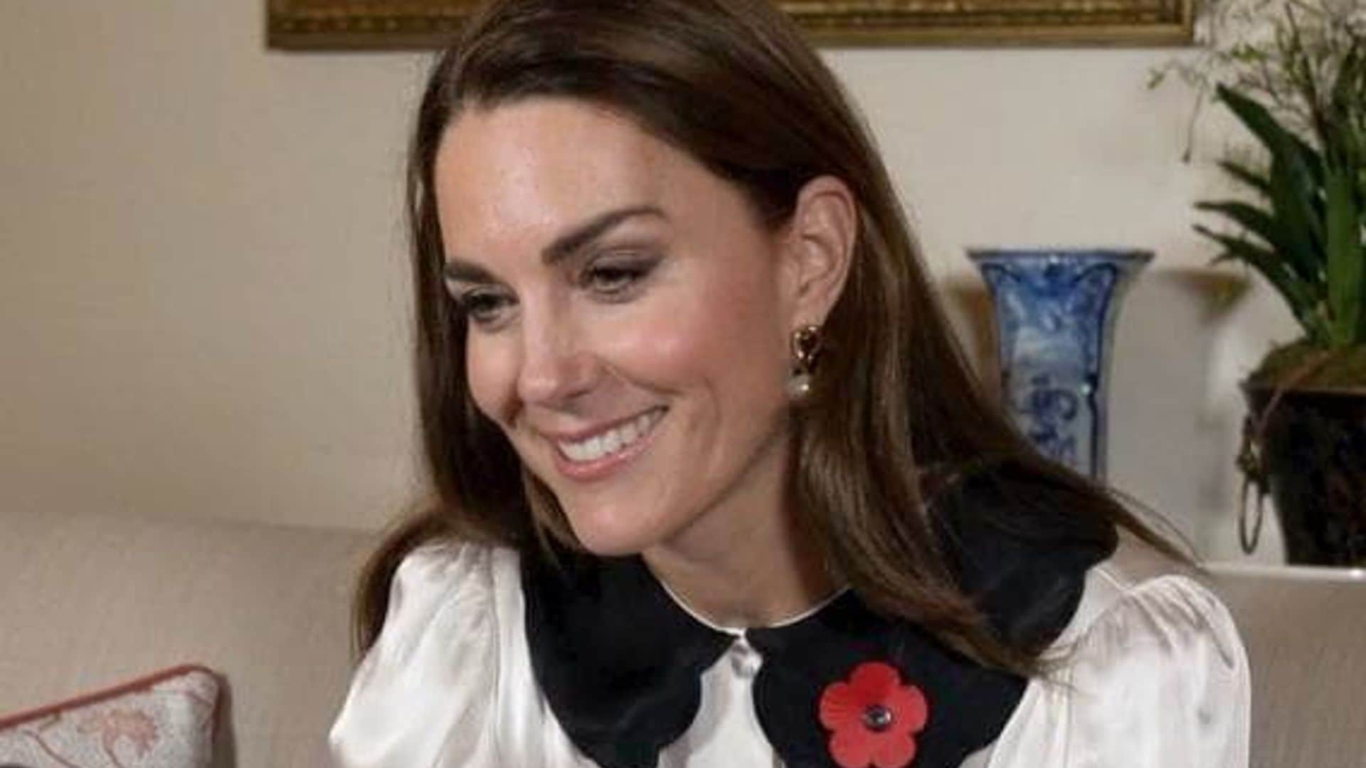 Kate Middleton speaks to military families surrounded by her own family photos