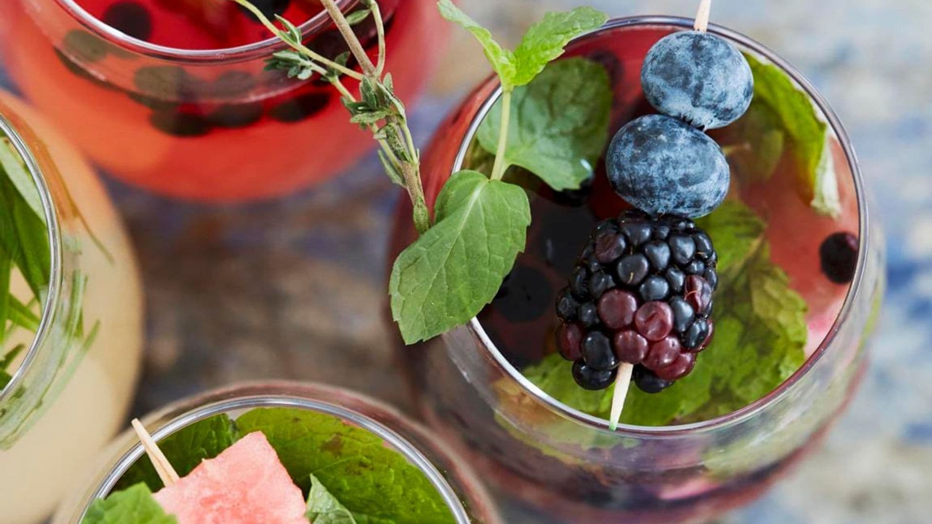 Various cocktails with fruits and herbs (seen from above)