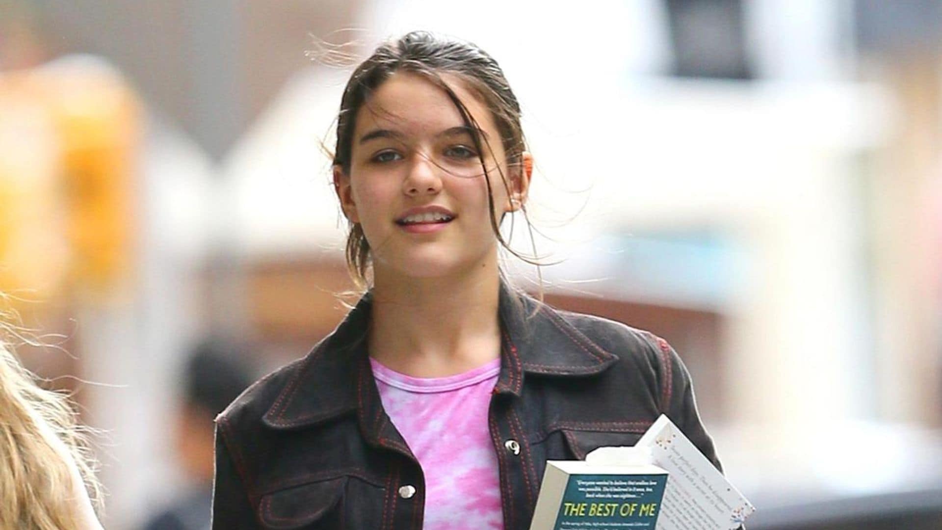 Suri Cruise enjoys New York City weather in a red strapless top and jeans