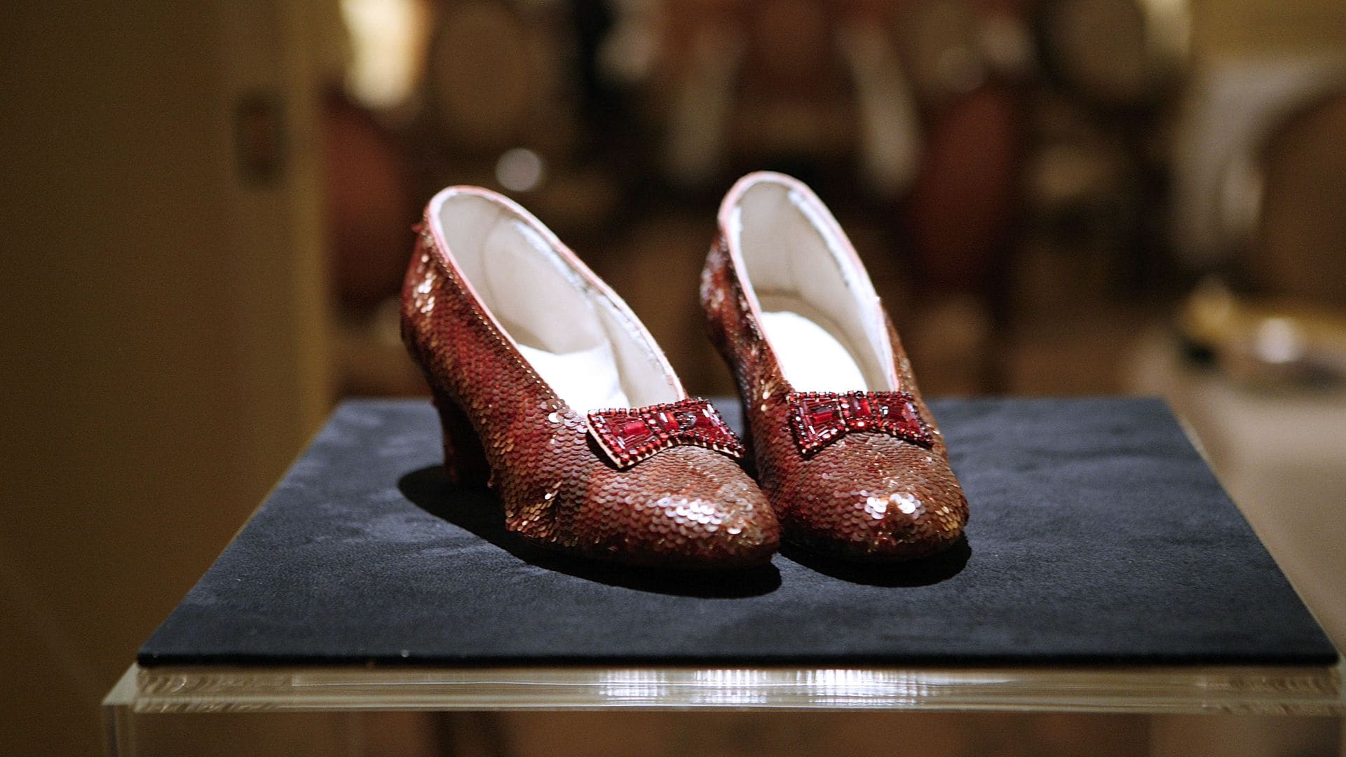 Why are the slippers silver instead of ruby red in 'Wicked'?