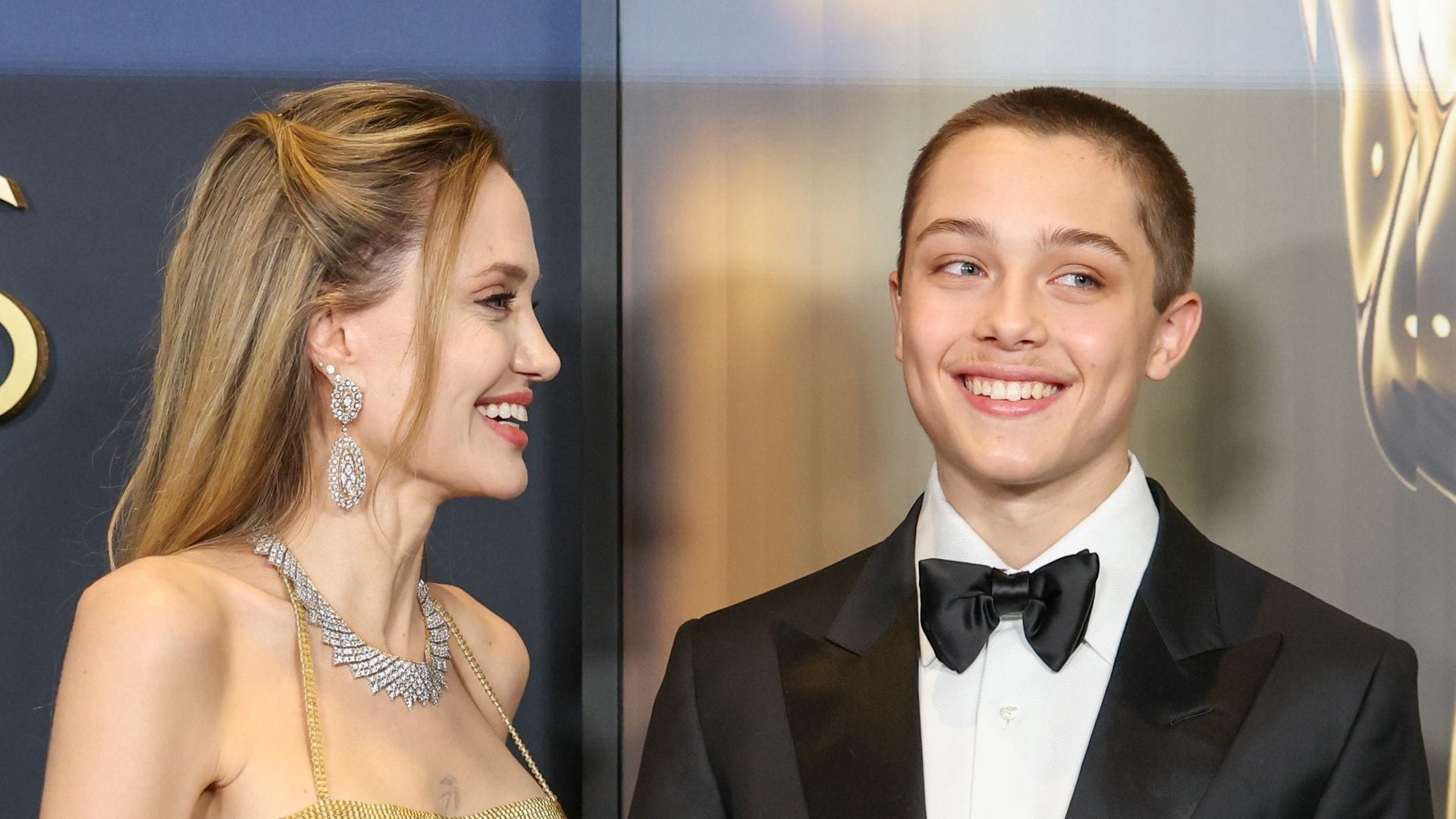 Knox Jolie Pitt looks strikingly like his parents as he buys groceries with a friend