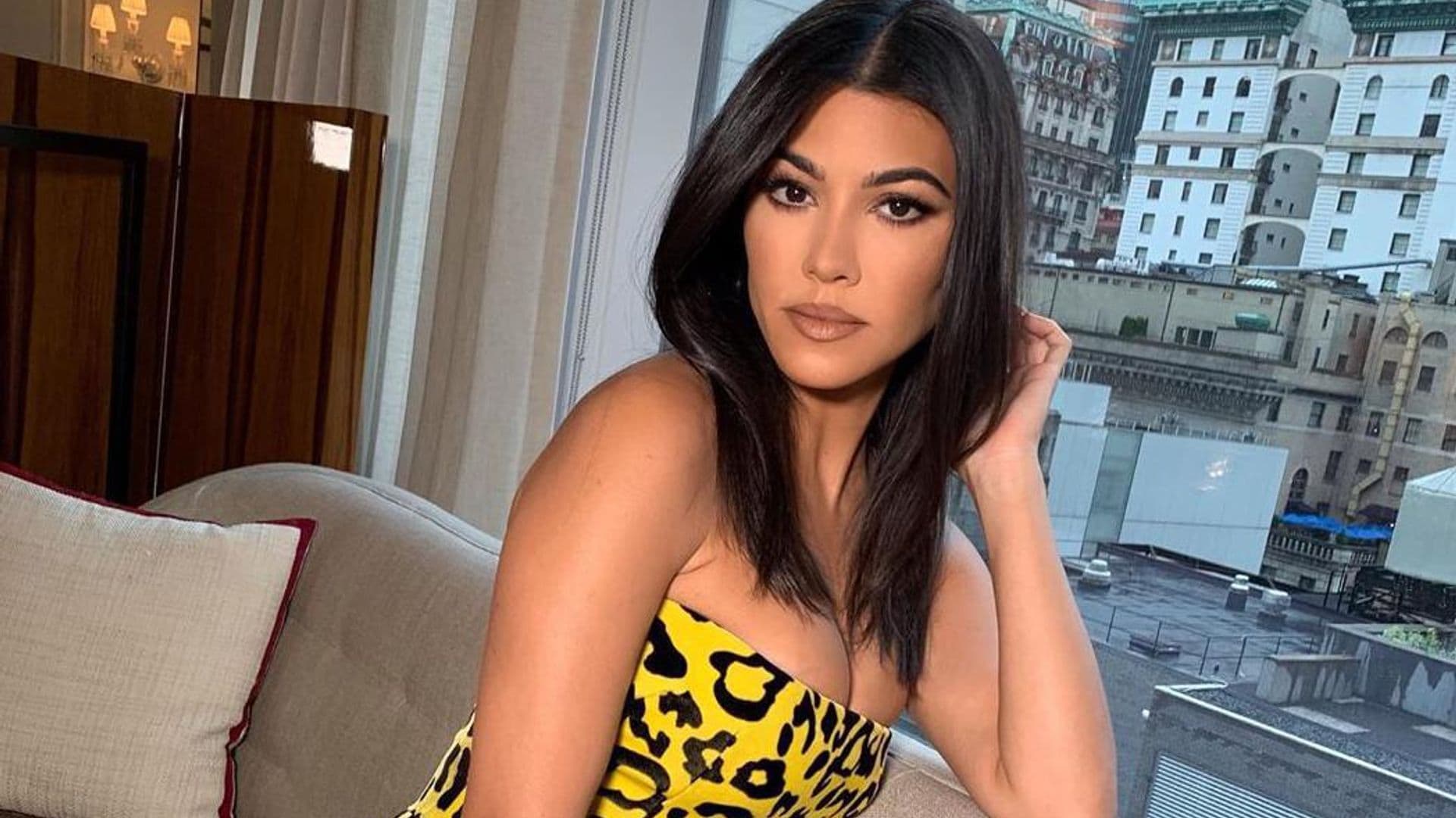 Kourtney Kardashian wearing Alex Perry animal print dress