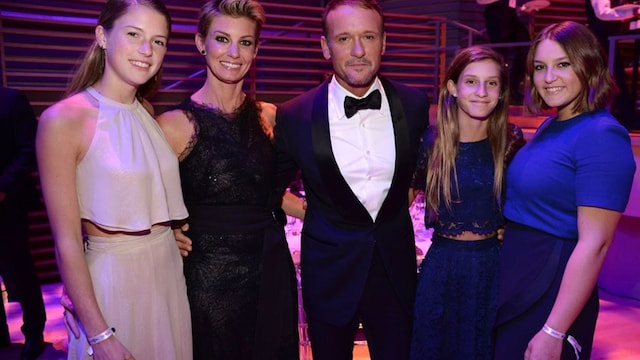 Tim, with wife Faith to his right, is protective of his daughters (from left to right) Maggie, Audrey and Gracie.
Photo: Kevin Mazur/Getty Images for TIME