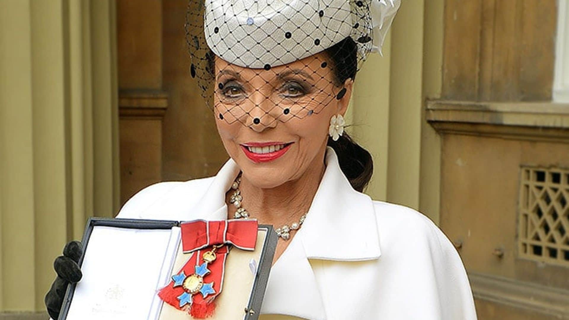 Joan Collins made dame by Prince Charles at Buckingham Palace
