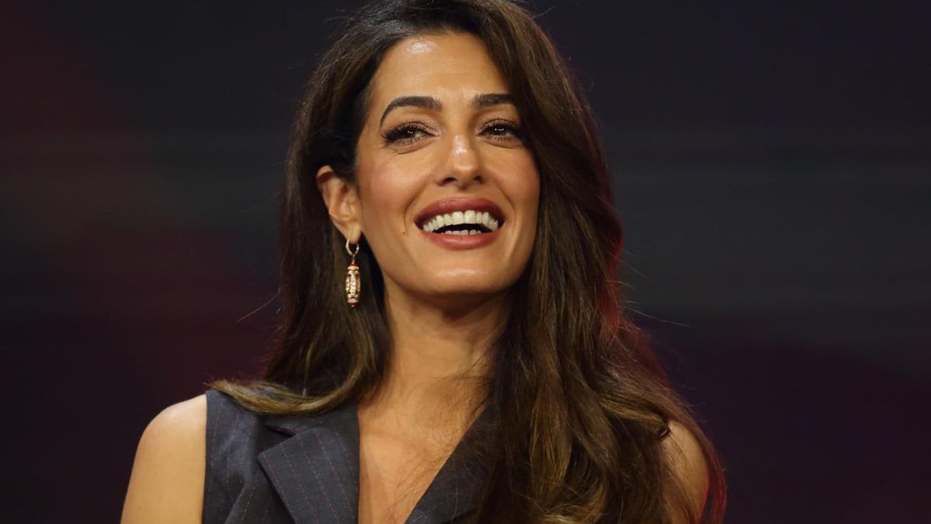 Amal Clooney mastered the disco look in dazzling mini dress during recent outing in Italy