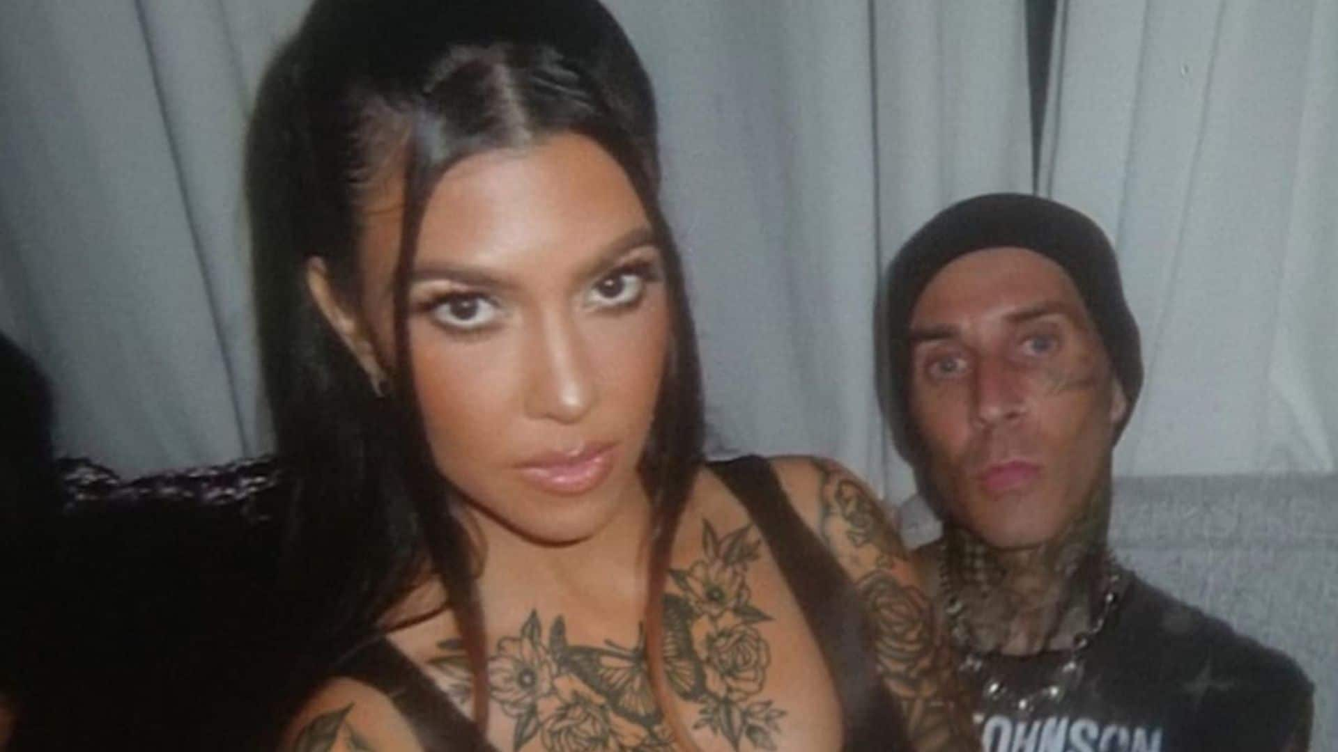 Travis Barker shares a snap of fiancée Kourtney Kardashian covered in tattoos