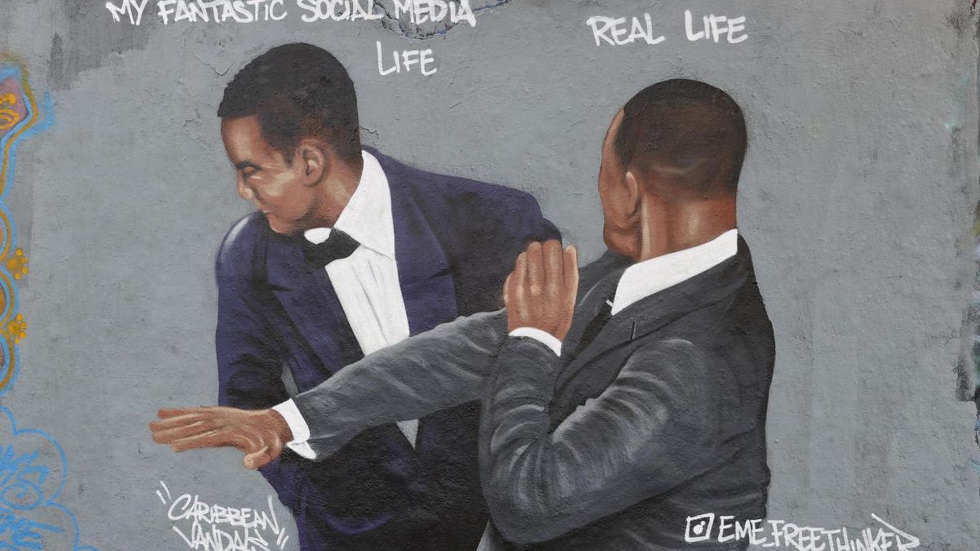Berlin-based Dominican artist Jesus Cruz Artiles paints a mural depicting Will Smith’s Oscars slap