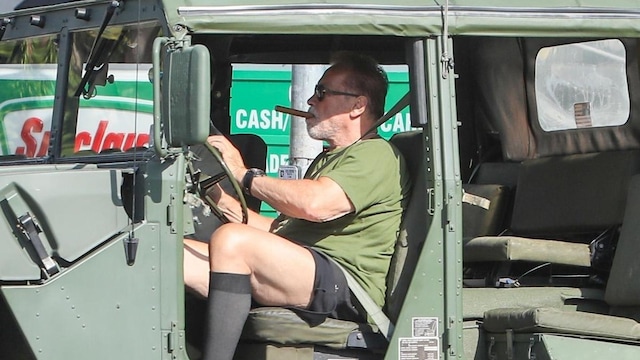 Arnold Schwarzenegger on his Hummer