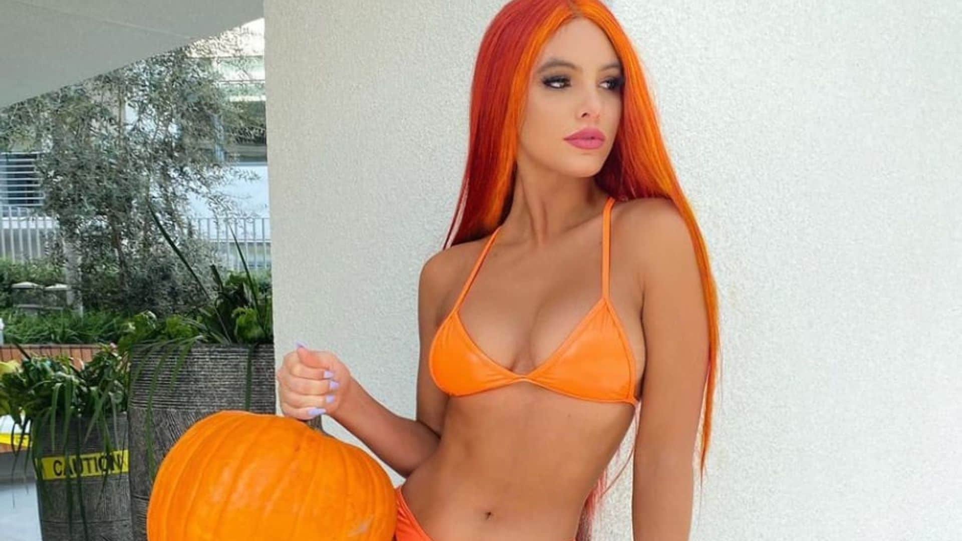 Lele Pons goes full Halloween glam in an orange bikini
