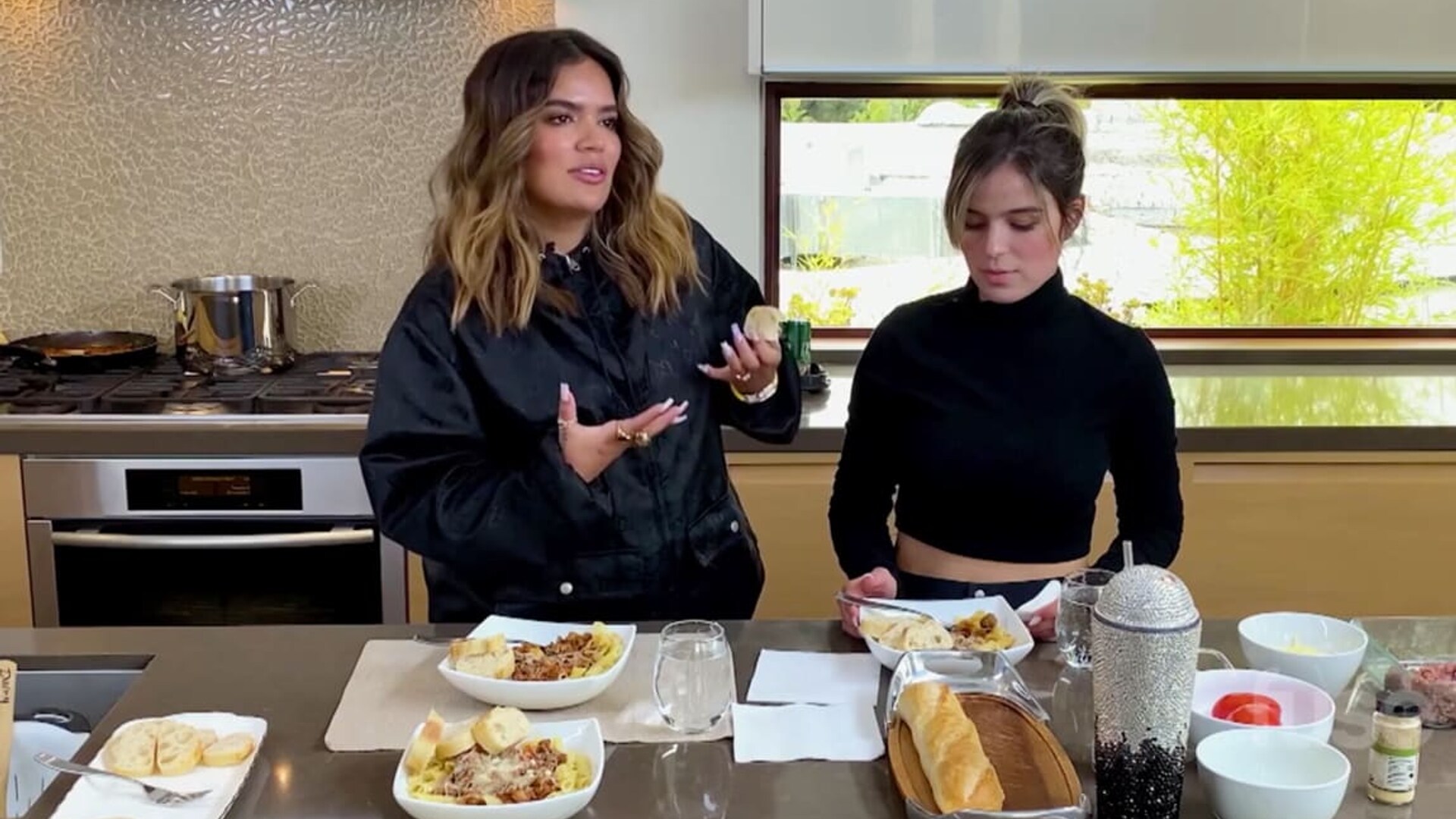 Karol G and her sister cooking favorite childhood dish.