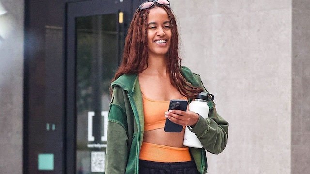 Malia Obama was seen leaving Solidcore gym with a friend, looking happy and refreshed after a workout. Malia looked radiant post-workout as she exited in an orange workout set showing off her toned midriff.