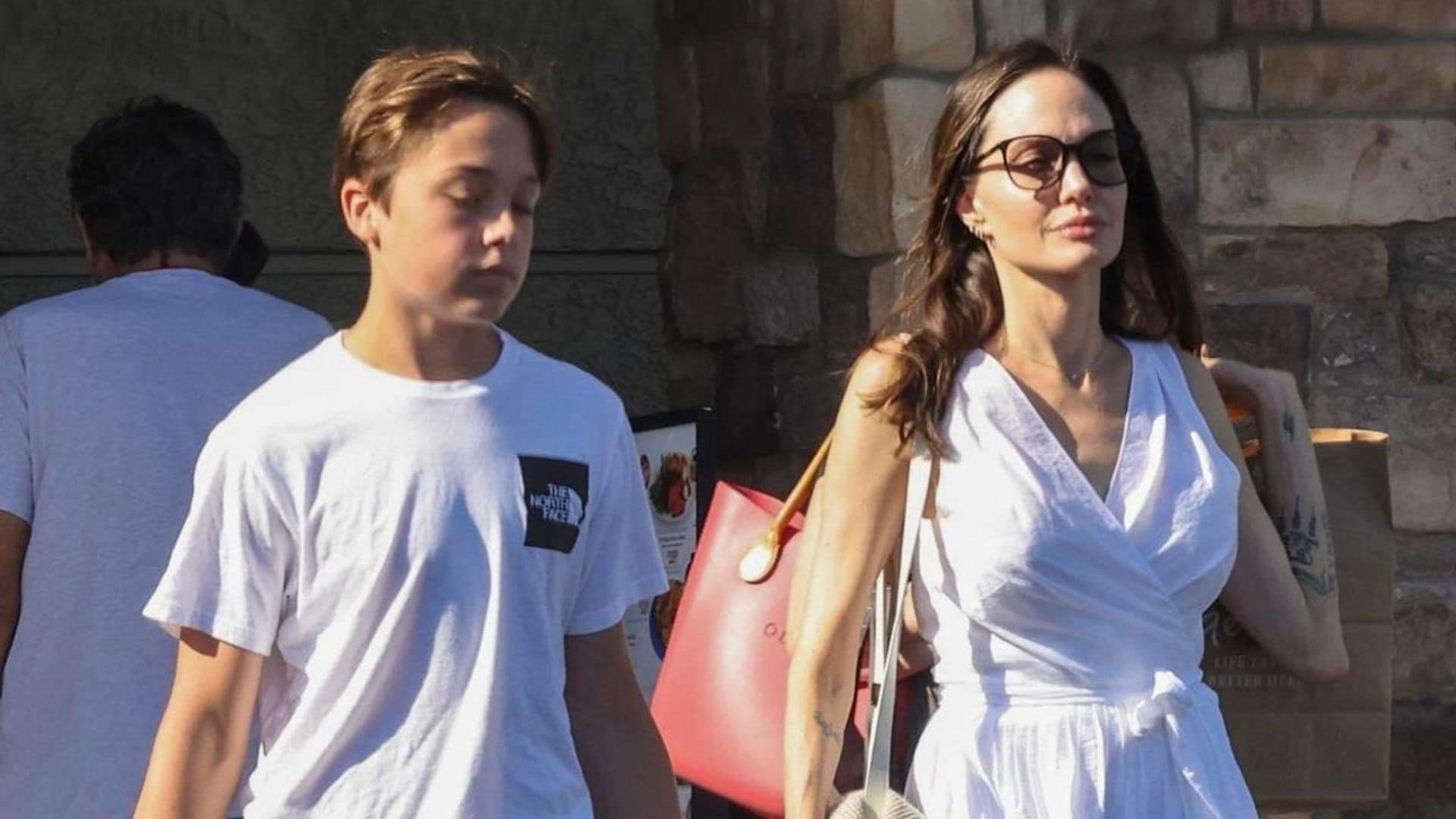 Angelina Jolie wears all white as she goes shopping with her son Knox in Los Angeles