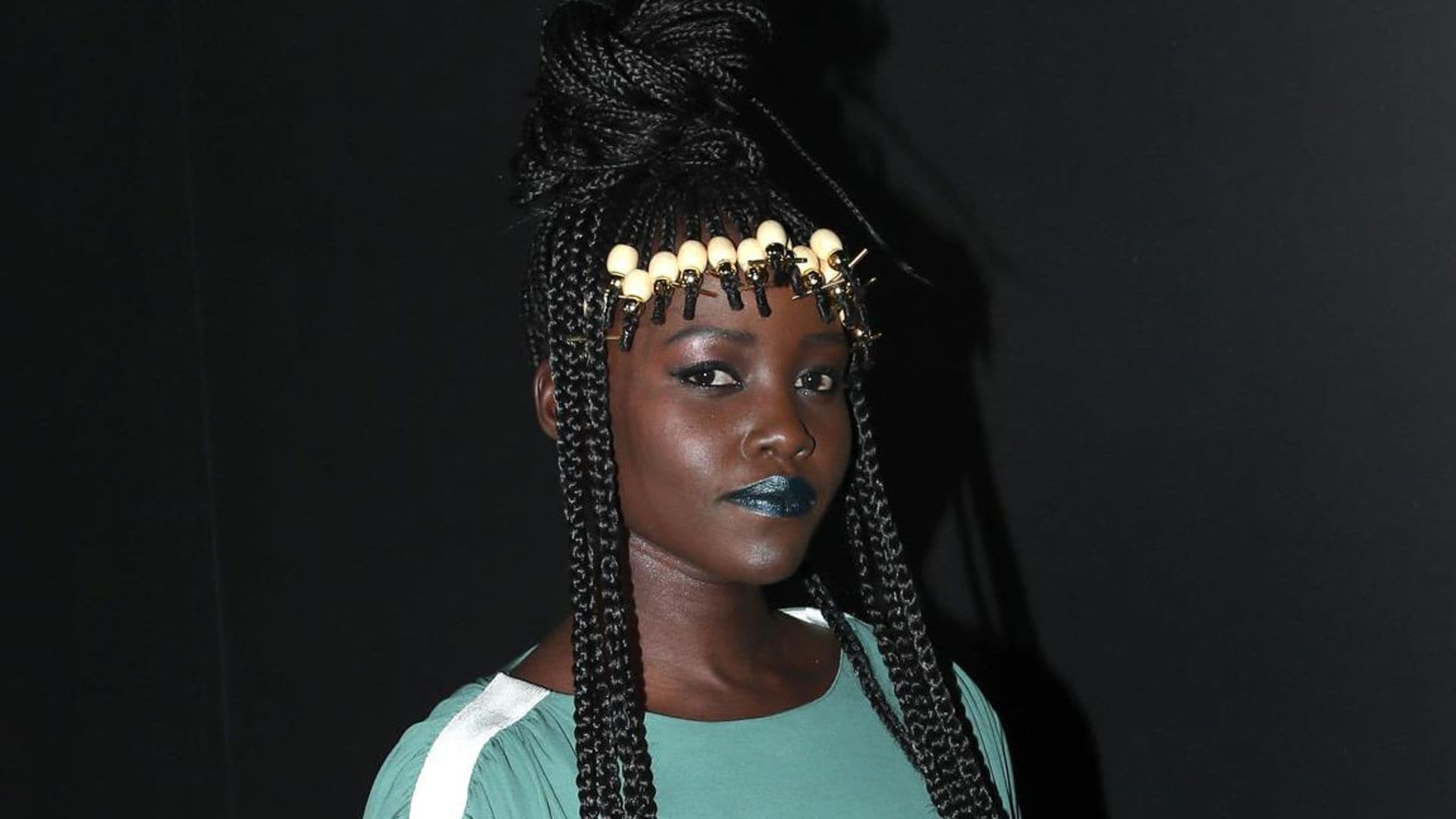 Lupita Nyong’o makes a bold beauty statement and rocks metallic green lips at Paris Fashion Week