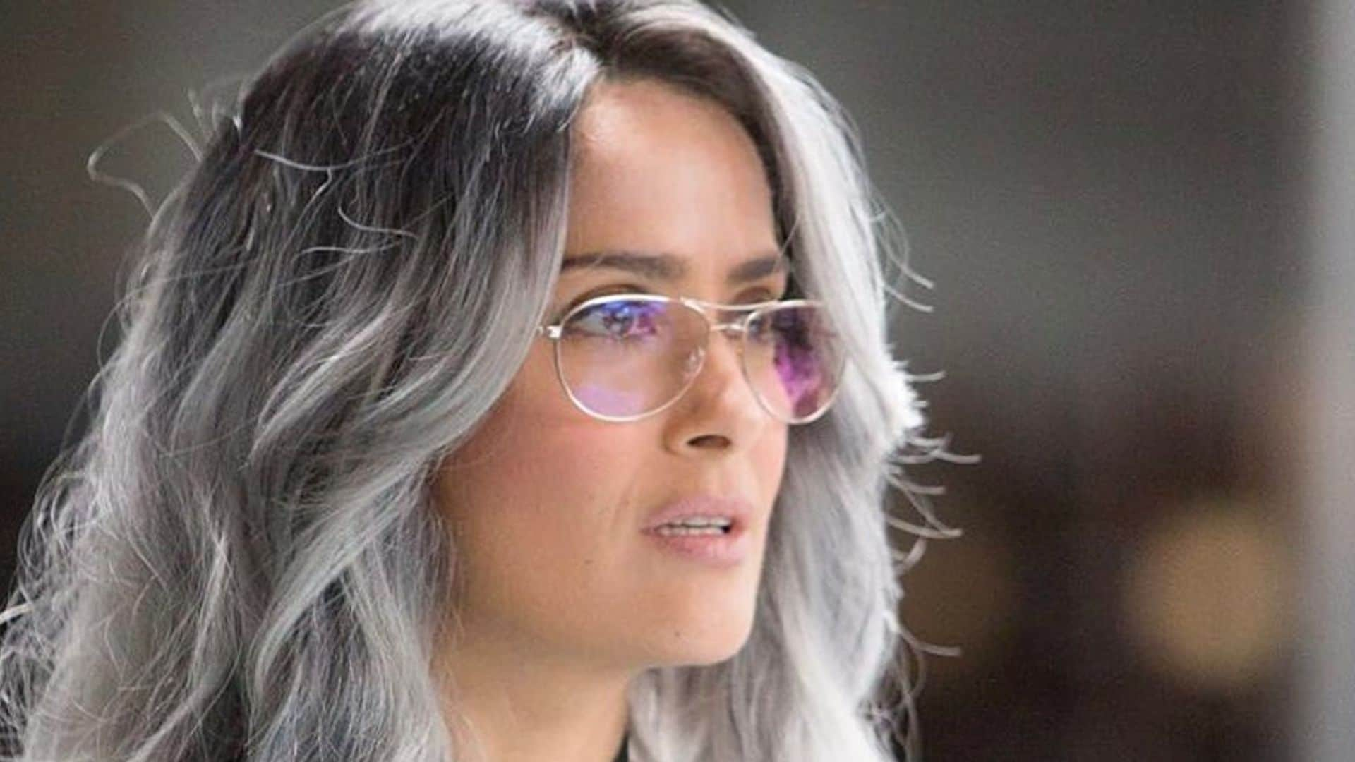 Salma Hayek transforms on movie set with tattoos and vinyl jumpsuit