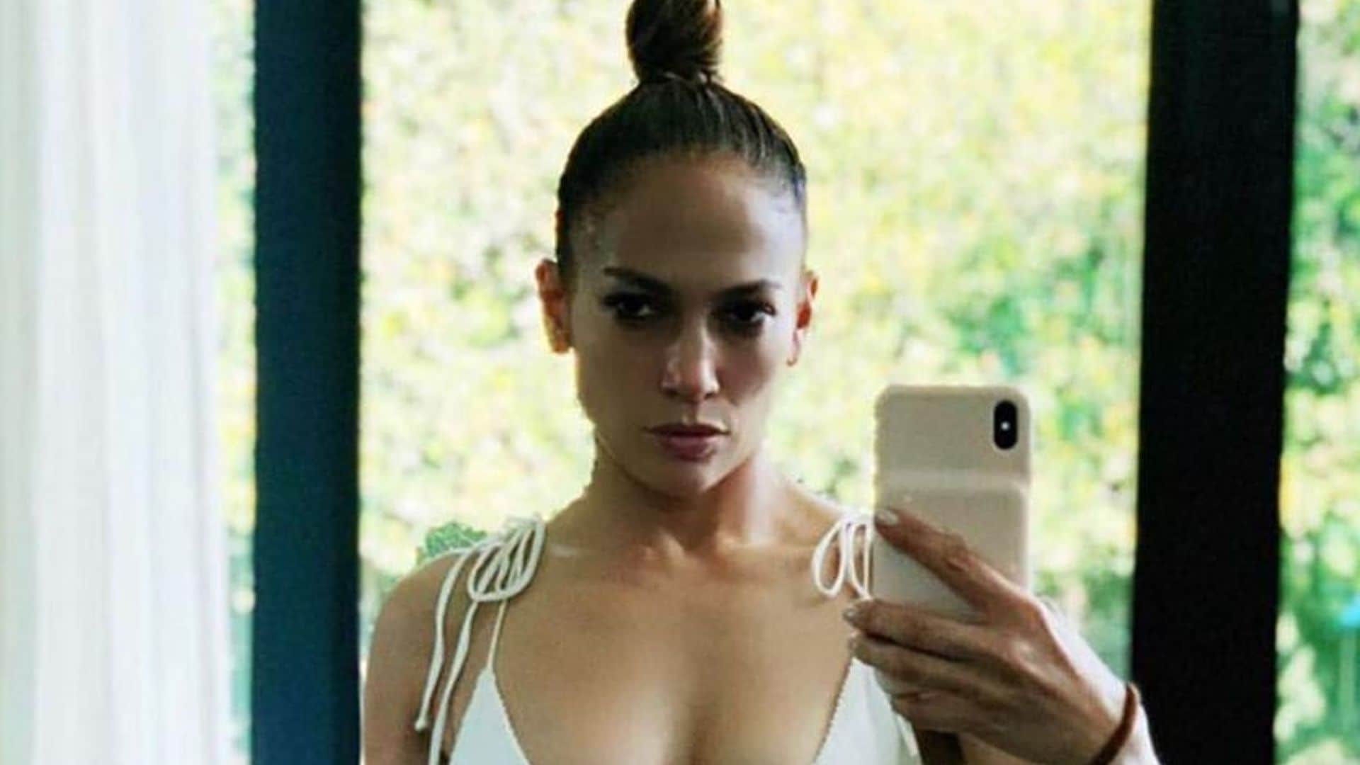 Jennifer Lopez posing in white bikini