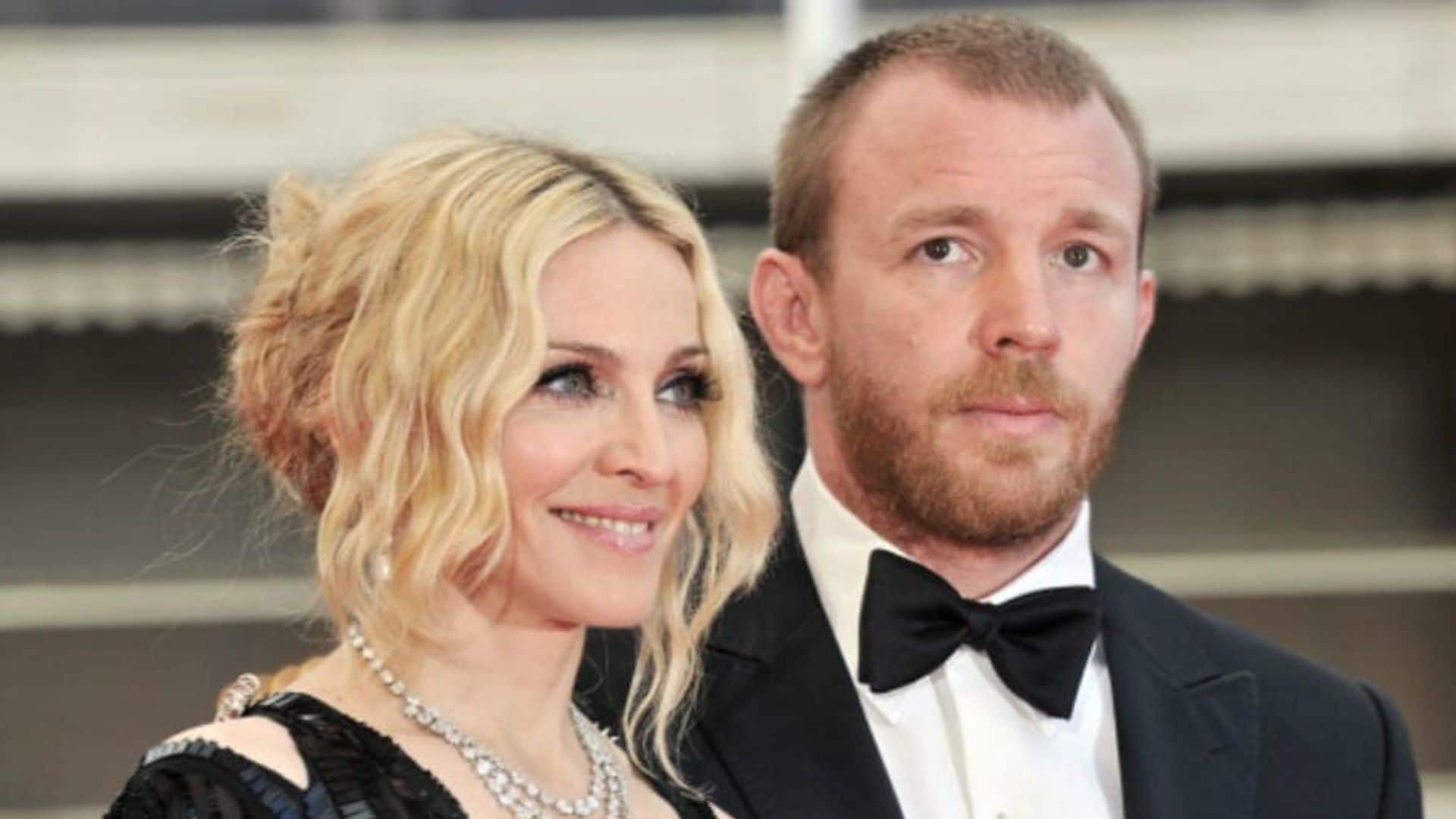 Guy Ritchie brings a bottle of wine as he visits Madonna's house