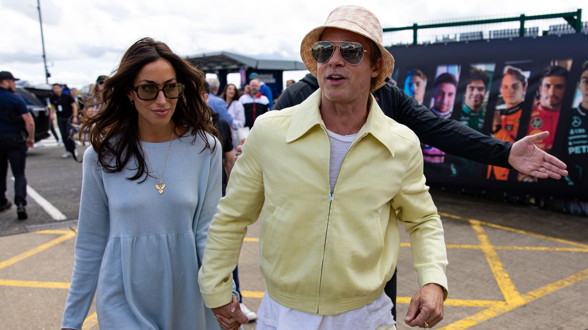 Brad Pitt and Ines de Ramon display their love at the British Grand Prix