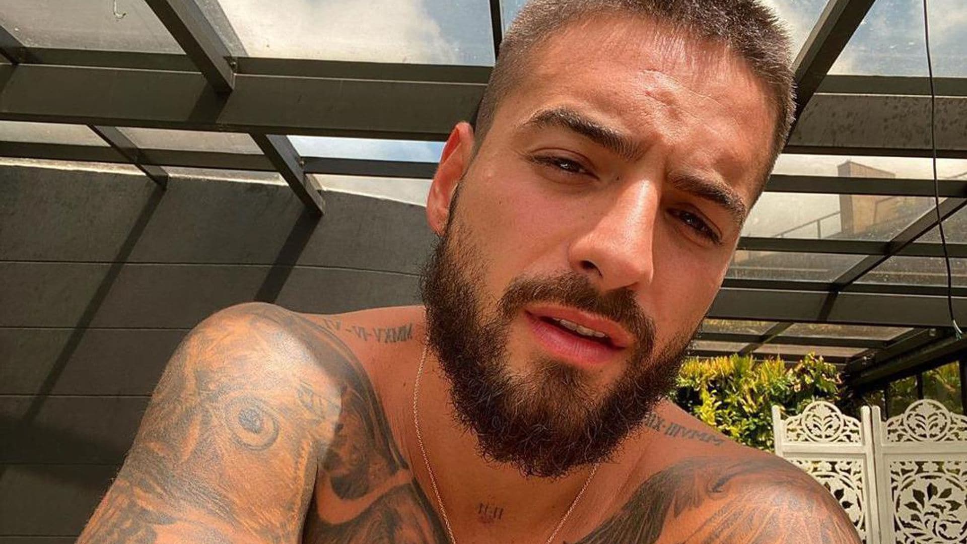 Maluma shows off impressive six-pack abs and tattoos during shirtless dance