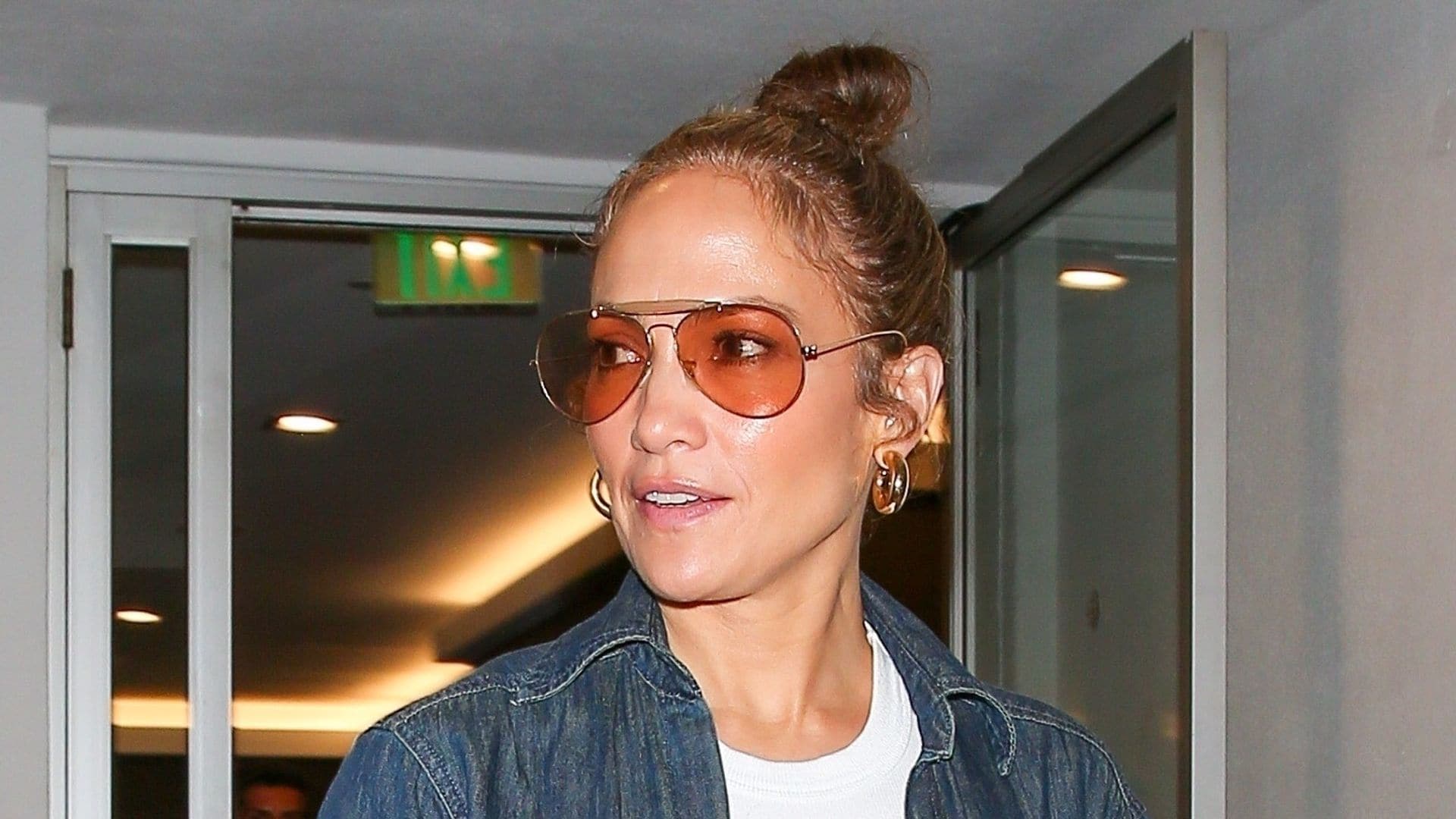 Jennifer Lopez rocks a double-denim look with a sentimental piece of jewelry