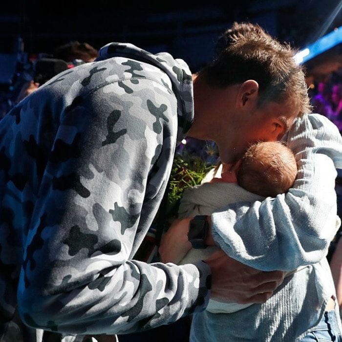 The gold medalist planted a kiss on his son after coming in first during an Olympic trial.
<br>
Photo: Al Bello/Getty Images