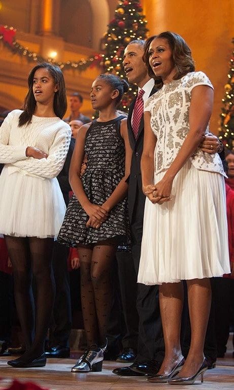 December 2013: Singing in perfect fashion! Malia and Sasha were in perfect color coordination with their parents during TNT's 'Christmas in Washington' special.
<br>
Photo: Getty Images