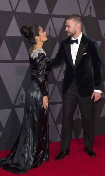 Justin Timberlake seemed to take a page from Jake's fashion book, exchanging his "suit and tie" for a velvet jacket and bowtie. In a fun carpet moment, the superstar caught up with Salma Hayek. The pair hugged and kissed, before heading into the event.
Photo: VALERIE MACON/AFP/Getty Images