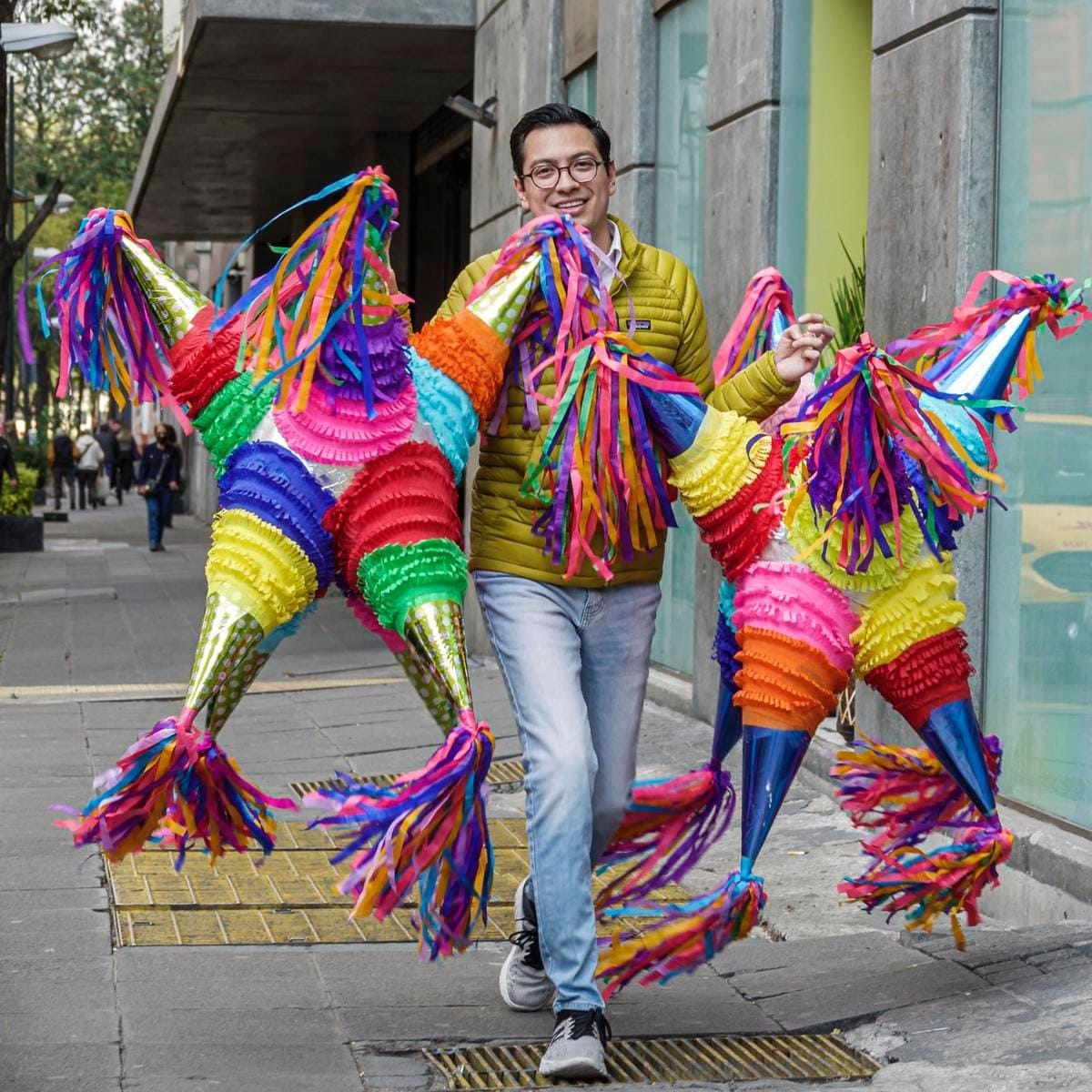 Mexico City, Mexico, vendor carrying pinatas for sale