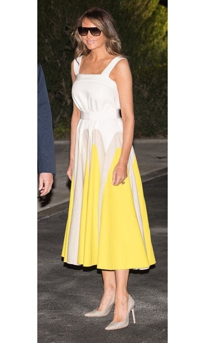Melania Trump looked summer chic as she returned to the White House on August 20 after a 17-day working vacation wearing a white and yellow midi-length Delpozo frock that originally retailed for $2,300 but has since sold out.
Photo: NICHOLAS KAMM/AFP/Getty Images