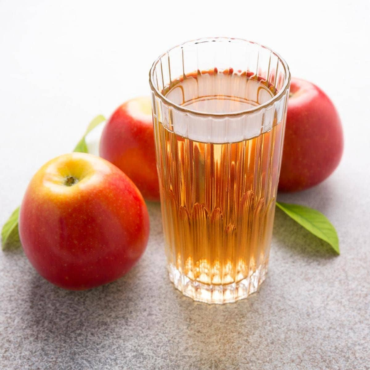 glasses of apple juice and red apples, autumn harvest