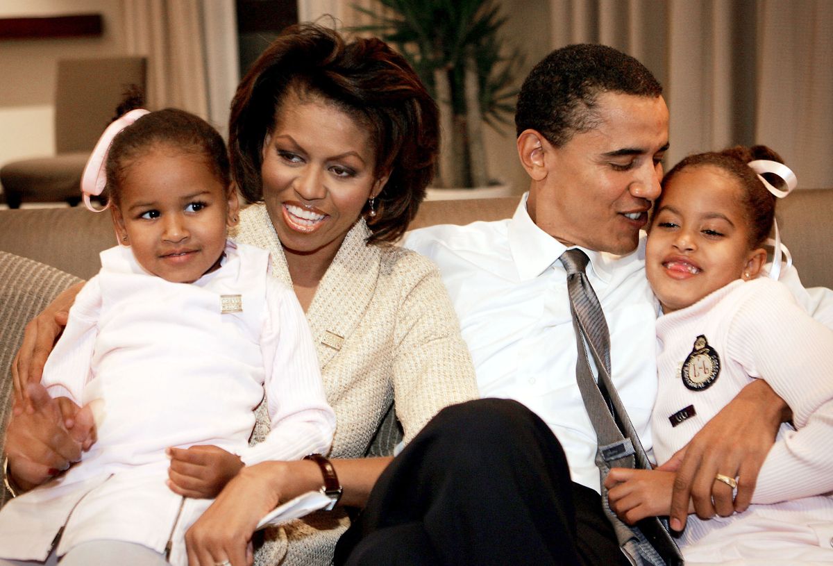 Barack Obama (D-IL) sits with his wife Michelle and daughters Sasha and Malia in Chicago.