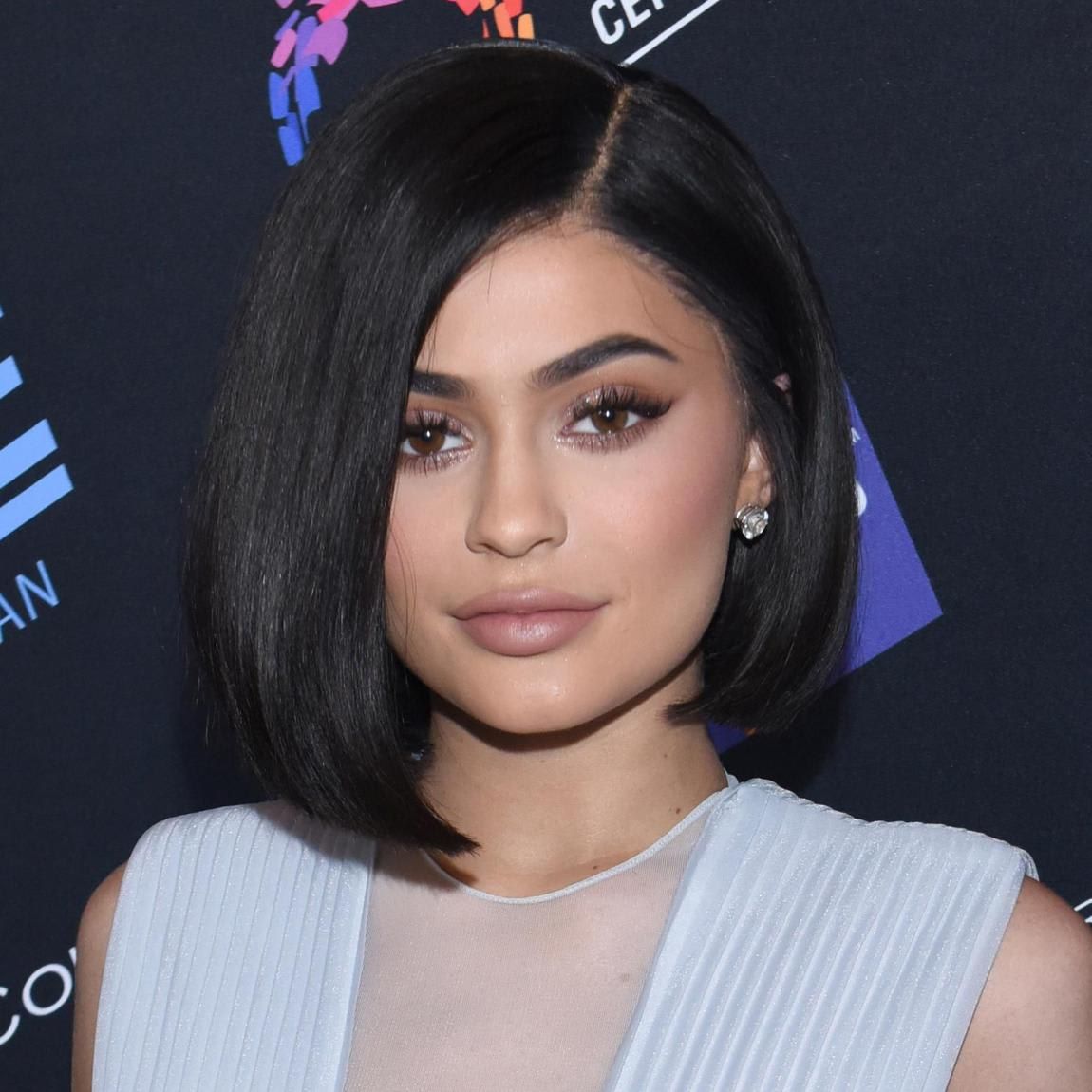 Kylie Jenner with a dark bob cut in a light blue dress