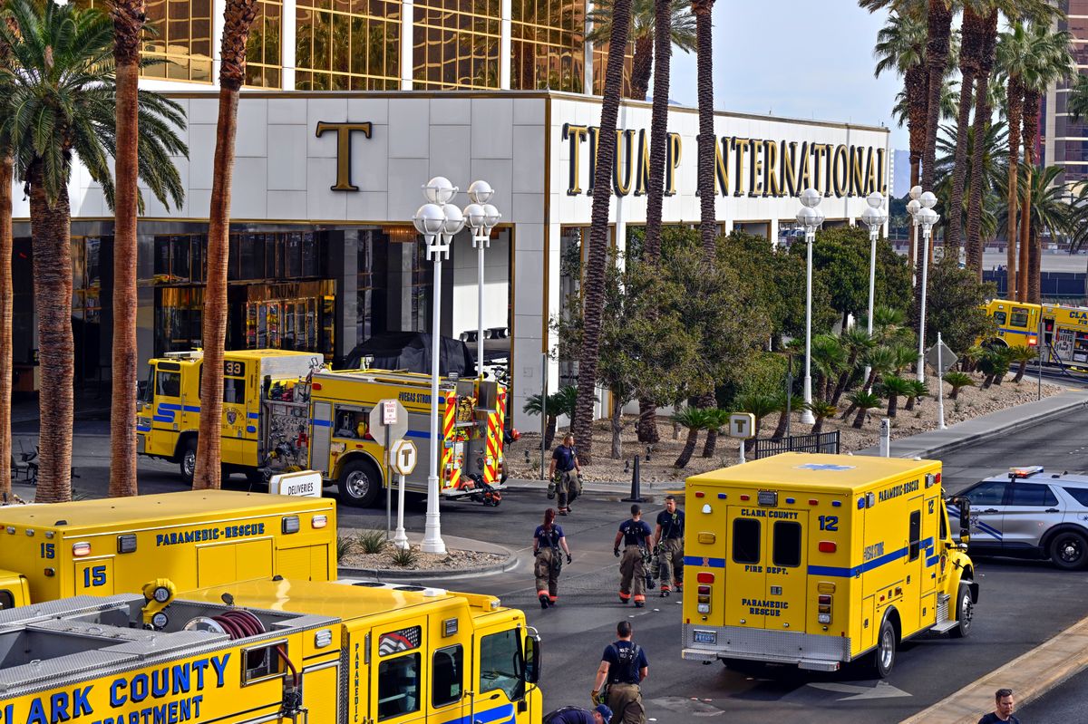 Clark County fire vehicles surround the valet area where a Cybertruck caught fire at the Trump International Hotel 