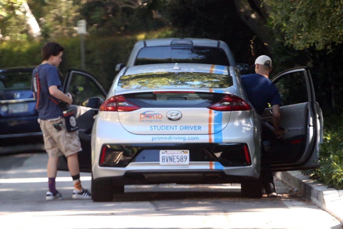 Fin Affleck is seen jumping into the driver's seat on August 28, 2024 while the two take driving lessons.