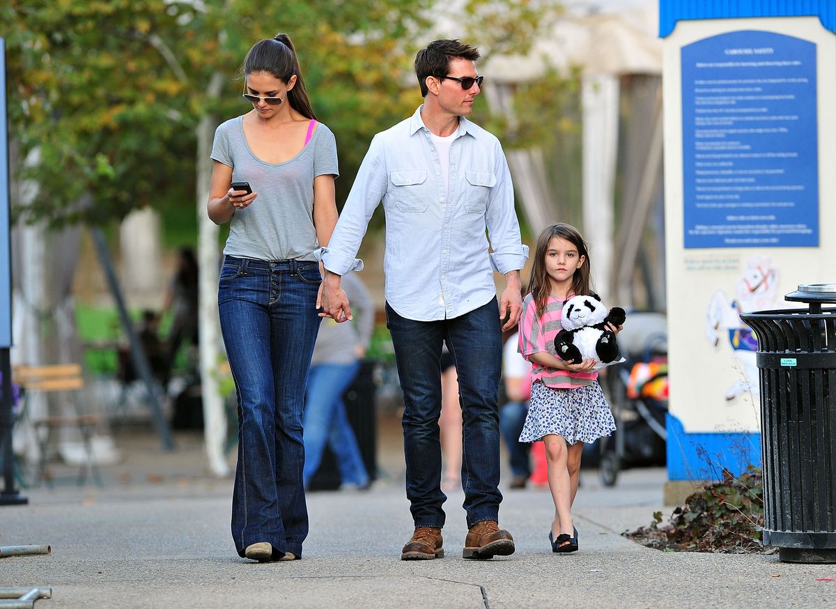 Katie Holmes, Tom Cruise, and Suri Cruise visit Schenley Plaza's carousel on October 8, 2011, in Pittsburgh, Pennsylvania. 