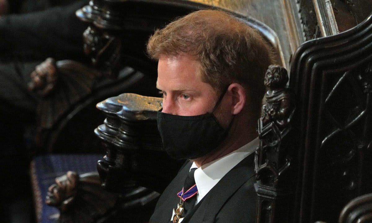 An emotional Prince Harry, Duke of Sussex sitting at St George's Chapel